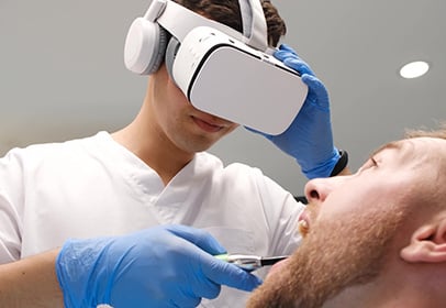 Image of a dentist performing a dental provide through a VR tool
